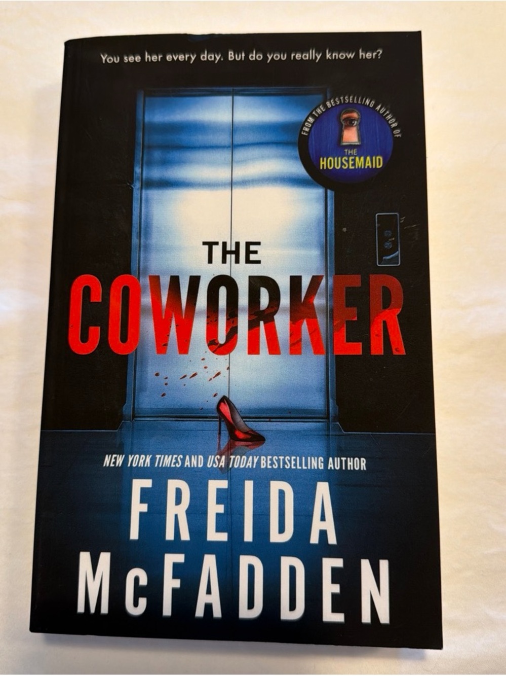 The Coworker by Freida Mcfadden Black & Blue Thriller Paperback